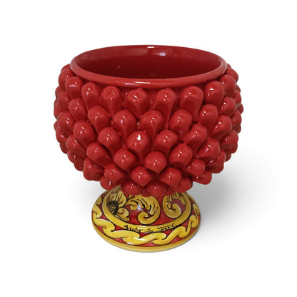 red handmade pine cone plant holder