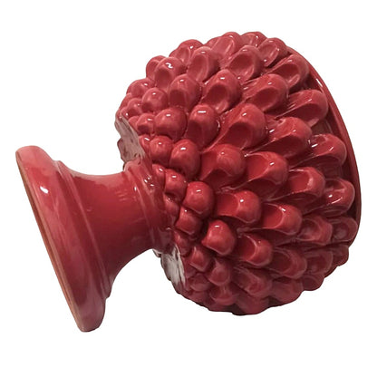 Pigna rossa ceramica siciliana, significato pigna